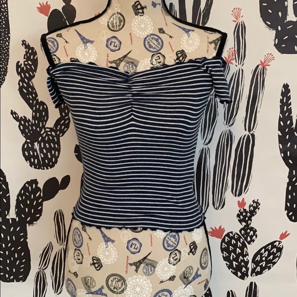 A navy blue and white off the shoulder top
